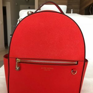 Henri Bender Orange-Red backpack.